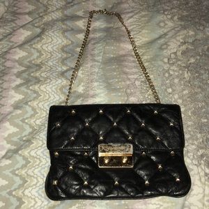 Authentic Micheal Kors shoulder bag. Black & gold.